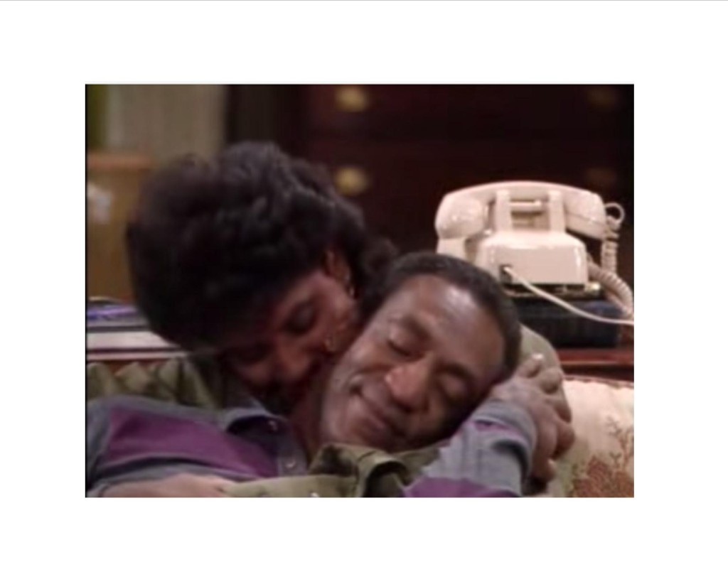Screenshot of a Cosby Show episode featuring Cliff and Claire snuggling on the sofa
